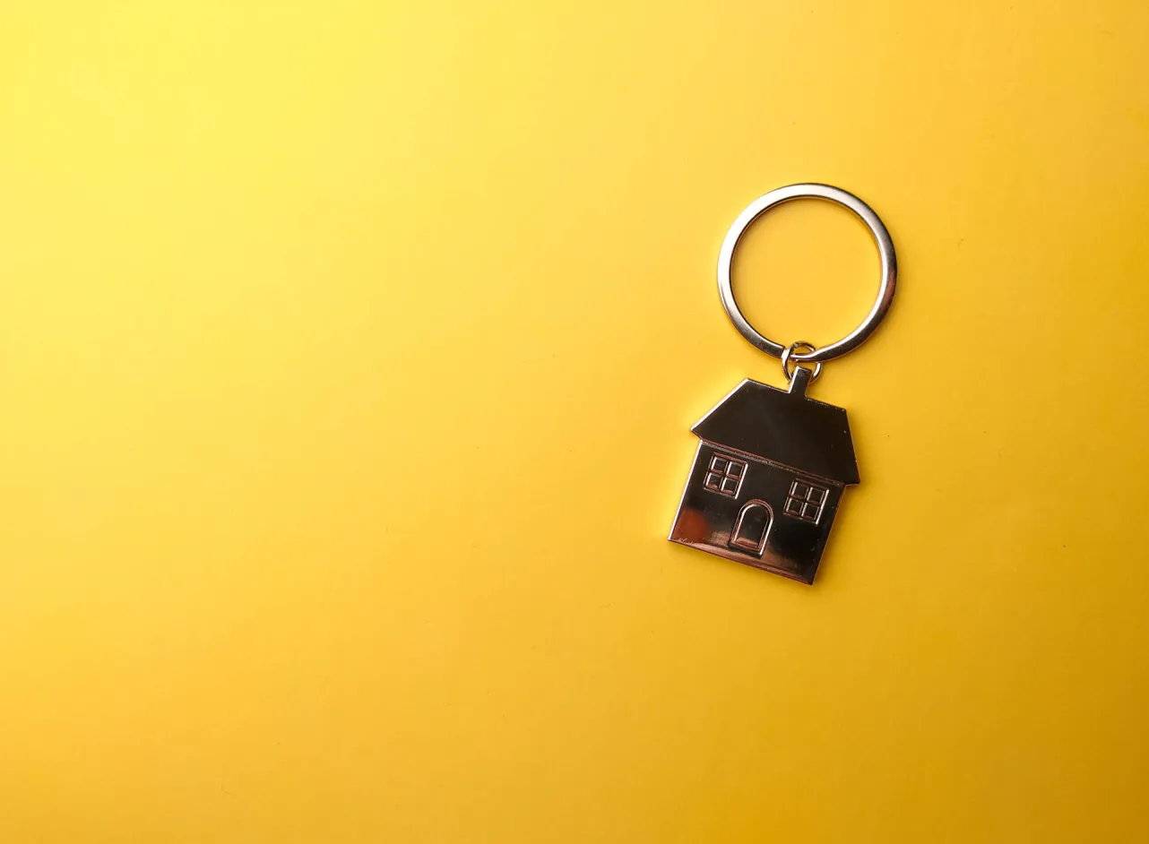 house keyring on yellow background 